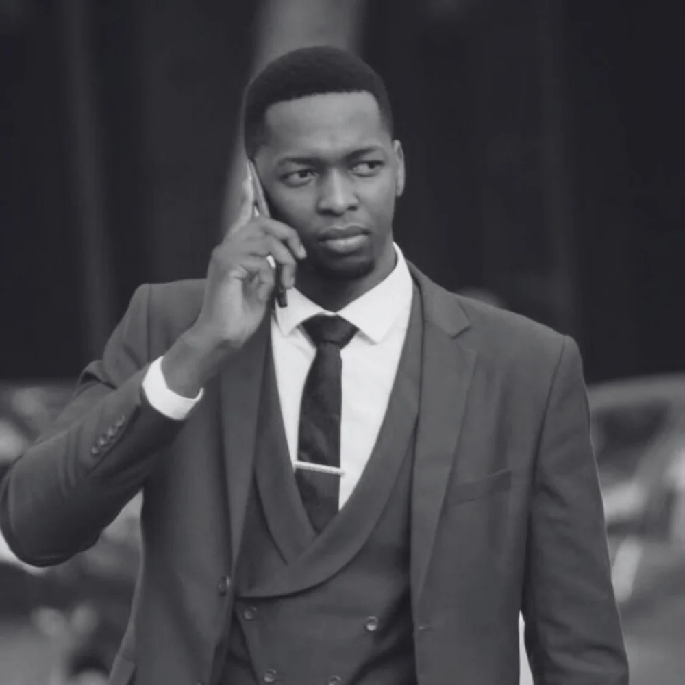 A picture of Farai Chimbwedza on the phone